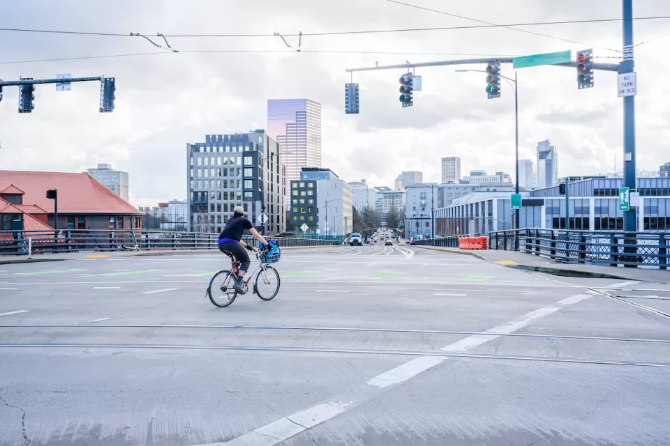 Person on bike in empty intersection in Portland, Oregon.
